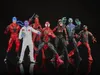 A group of action figures standing against a black background. Anteprima dell’immagine prodotto