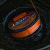 A spool of fishing line submerged in water. Anteprima dell’immagine prodotto