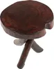 A wooden stool with a round, textured top and three legs. Náhled obrázku produktu