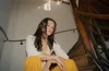 A person sitting on a spiral staircase. Voir les images du produit