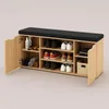 A shoe cabinet with a bench seat on top, showing various shoes and rolled towels inside. Náhľad obrázku produktu