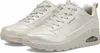A pair of beige Skechers sneakers are shown from a slightly elevated side angle against a white background. Voir les images du produit