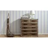 A dresser with drawers and a lamp on top, next to a decorative wooden object, against a striped wallpaper. Produktbild-Vorschau