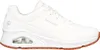 A white Skechers UNO SR shoe with a brown sole is shown from the side against a white background. Produktbild-Vorschau