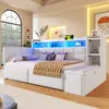 A modern white daybed with integrated LED lighting, shelves, and storage in a well-lit room. Produktbild-Vorschau
