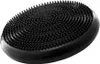 A black, oval-shaped balance cushion with raised nubs on its surface, shown from a slightly elevated side angle against a white background. Produktbild-Vorschau