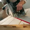 A person is using a circular saw to cut wood. Produktbild-Vorschau