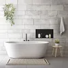 A modern bathroom with a freestanding bathtub, tiled walls, and a built-in niche. Náhled obrázku produktu