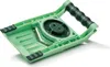 A green vegetable slicer with a black handle, shown at an angle on a white background. Voir les images du produit