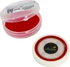 A carrom striker and its container are shown against a white background. The striker is white with red and black accents and the brand name 'Premia' is visible. The container is clear plastic with a red pad inside and has a sticker with text and a QR code. Produktbild-Vorschau