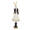 A full-body shot of a decorative rabbit figurine dressed in a black jacket and a white dress, holding a gold purse. Náhľad obrázku produktu