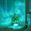 A lamp projects aurora-like lights onto a wall and blinds, with flowers in a vase nearby. Anteprima dell’immagine prodotto