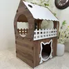 A two-story cat house made of wood with white accents. Produktbild-Vorschau