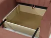 Close-up view of the open storage compartment of a sofa. Náhled obrázku produktu