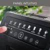 A close-up of a coffee machine's control panel with a finger pressing a button. Voir les images du produit