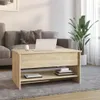 A coffee table in a living room setting with a sofa and a plant. Produktbild-Vorschau