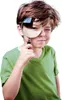 A young boy is looking through a magnifying glass at the camera. Voir les images du produit
