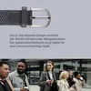 A close-up of a belt buckle and strap, with a group of people walking in the background. Anteprima dell’immagine prodotto