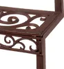 A close-up view of a brown cast iron plant stand with decorative scrollwork. Anteprima dell’immagine prodotto