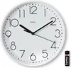 A white analog wall clock with black numbers and hands, shown with a battery on the right side. Anteprima dell’immagine prodotto