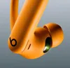A close-up shot of orange Beats by Dre Powerbeats Pro earbuds. Náhled obrázku produktu