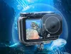 An action camera in a waterproof case is shown underwater with a diver in the background and jellyfish floating around. Produktbild-Vorschau