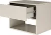 A modern, minimalist nightstand with one drawer partially open and an open shelf below, shown against a white background. Voir les images du produit