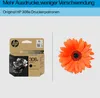 A product shot of an HP ink cartridge next to an orange gerbera daisy. Voir les images du produit