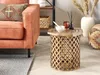 A living room scene featuring a couch, a side table, and decorative items. Produktbild-Vorschau