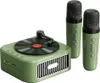 A green retro-style Bluetooth speaker with a vinyl record on top, accompanied by two green microphones. Náhled obrázku produktu