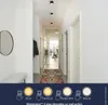 A hallway with ceiling lights and a rug on the floor, with a promotional overlay at the bottom. Podgląd zdjęcia produktu
