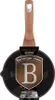 A Berlinger Haus frying pan with a rose gold handle is shown against a white background. A shield-shaped logo with a 'B' is prominently displayed on the pan. Podgląd zdjęcia produktu