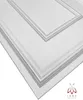 A close-up, angled view of white 3D wall panels with a textured surface and decorative beveled edges. Produktbild-Vorschau