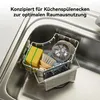 A sink organizer with cleaning supplies in a kitchen sink. Produktbild-Vorschau