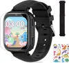 A black smartwatch with a screen displaying a cartoon dinosaur theme, shown with a screen protector and an additional strap and stickers. Produktbild-Vorschau
