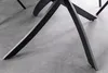 A close-up view of the black metal legs of a table on a gray floor. Produktbild-Vorschau
