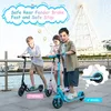 Three children on scooters in front of a Ferris wheel. Anteprima dell’immagine prodotto