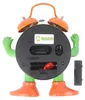 The back of a cartoon-like alarm clock with its battery compartment open. Produktbild-Vorschau
