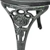 A close-up view of the ornate, rose-themed leg of a green cast aluminum bistro table. Voir les images du produit