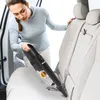 A woman vacuuming the interior of a car. Produktbild-Vorschau
