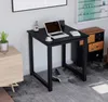 A black desk with a laptop, a plant, and a cup of coffee on it, placed in a room with other furniture. Anteprima dell’immagine prodotto