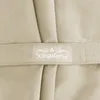 A close-up view of a beige fabric with a label that says "Kingsleeve". Anteprima dell’immagine prodotto