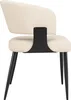 A side view of a single beige upholstered chair with black legs. Voir les images du produit