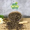 A bowl of buckwheat seeds with a wooden scoop and some decorative elements. Produktbild-Vorschau