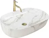 A white oval countertop sink with gold veining and a gold faucet. Anteprima dell’immagine prodotto
