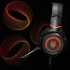 A gaming headset with glowing orange and red accents, set against a black background with abstract circular graphics. Voir les images du produit