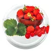 A close-up of strawberries and cherries on a white wooden surface, with a wooden bowl in the background. Podgląd zdjęcia produktu