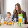A family is having breakfast, with a portable blender on the table. Náhled obrázku produktu