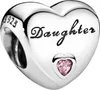 A silver heart-shaped charm with the word "Daughter" engraved on it and a small pink heart-shaped stone. Podgląd zdjęcia produktu