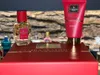 A gift set of Gisada Ambassadora perfume and shower gel is displayed on a red box. Voir les images du produit
